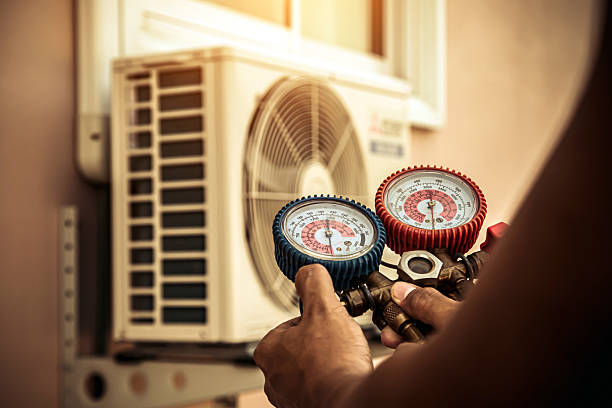 Professional Air Conditioning Service technician working in Fort Morgan, CO